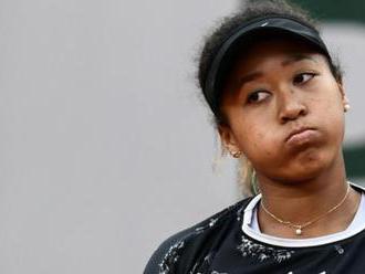 Osaka fights back from brink to reach second round
